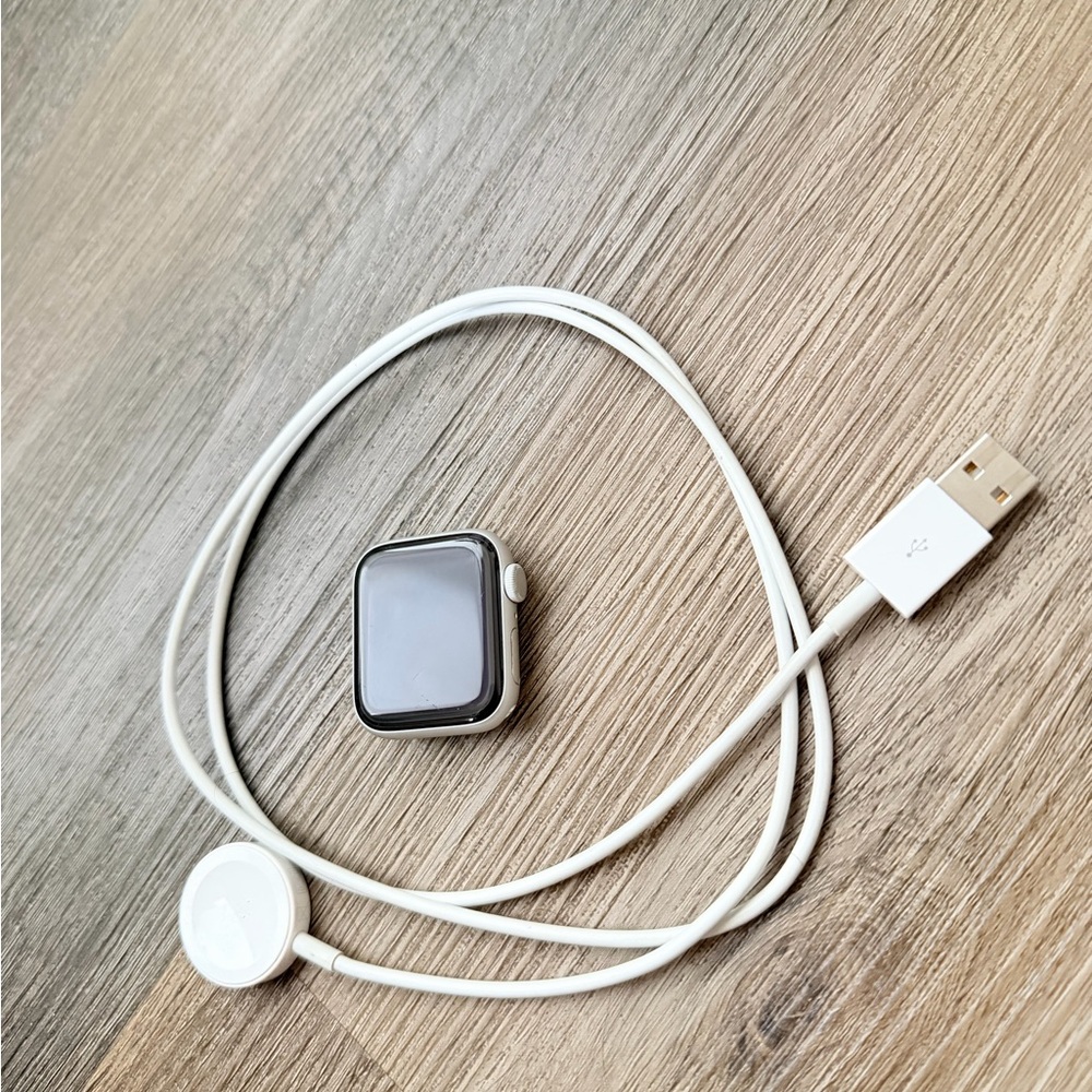 Apple Smartwatch with White Charging Cable